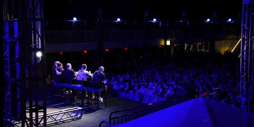 Shot of a night-time Q&A session with the Jokers on Impractical Jokers Cruise 4