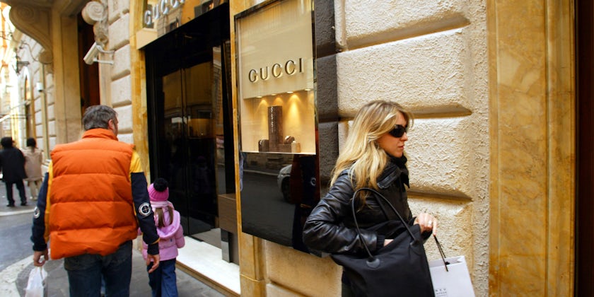 Shoppers pass a Gucci shop while luxury shopping along Via Condotti in Rome, Italy  (Photo: Northfoto/Shutterstock)