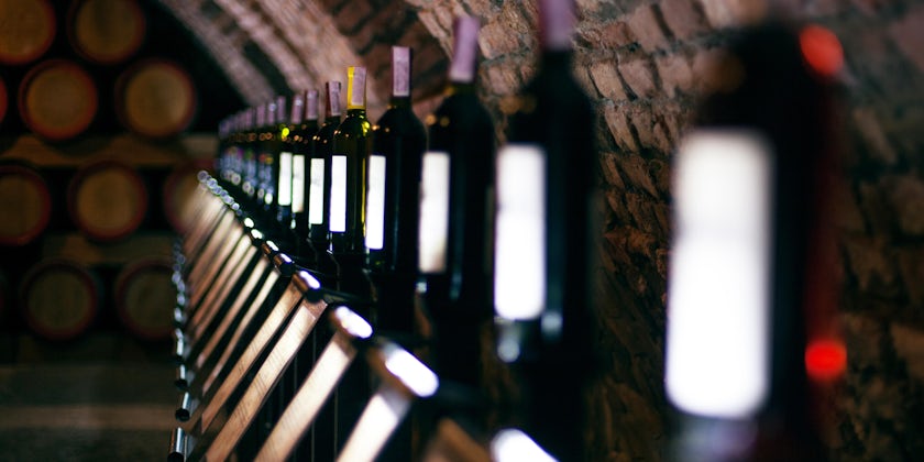Row of vintage wine bottles in a wine cellar (Photo: Paranamir/Shutterstock)