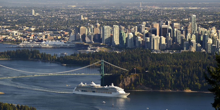 Cruise ship leaving Burrard Inlet (with Stanley Park, Lions Gate Bridge and the plane on the horizon), British Columbia, Canada
