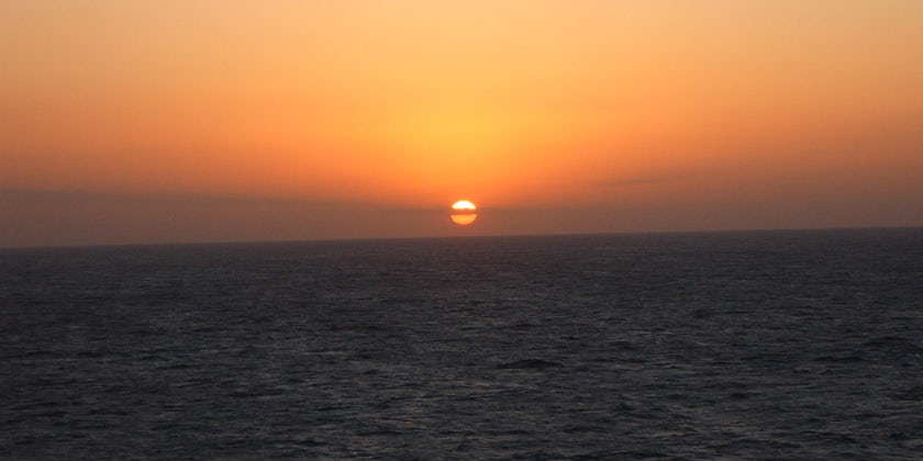 Panoramic shot of a orange and red Sunrise at Sea in Fujairah