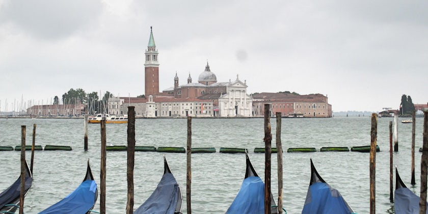 View of Venice from a row of gondolas on a cloudy day