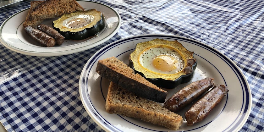 Close-up shot of egg breakfast with sausage and toast on Stephen Taber