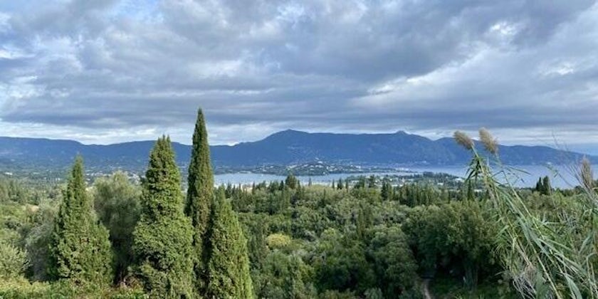 Green, rolling hills and coastline of Corfu during an e-bike excursion