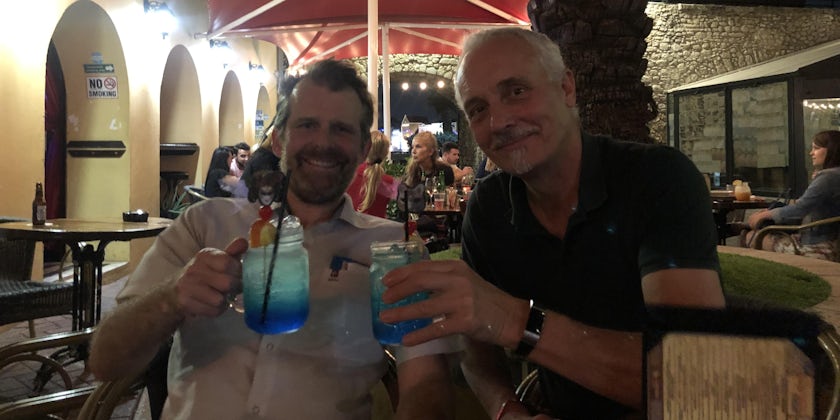 Adam Coulter and his friend Mark drinking Curacaos in Curacao