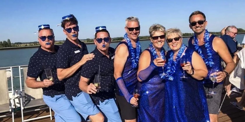 Color-coordinated cruise passengers on a Brand g Vacations sailing