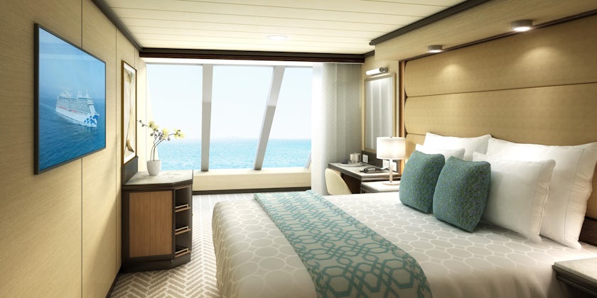 A deluxe oceanview cabin on Sky Princess with sun shining
