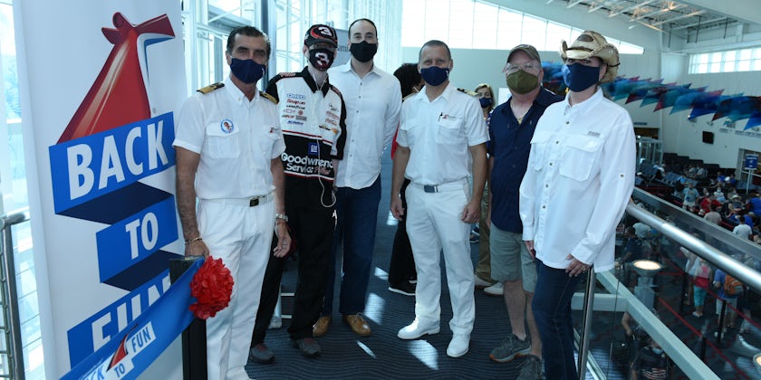 Carnival Horizon officers welcome passengers aboard Carnival Horizon at PortMiami on July 4, 2021