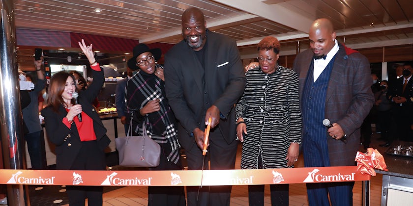 Shaquille O'Neal cuts the ribbon on Carnival Radiance. (Photo: Carnival Cruise Line)