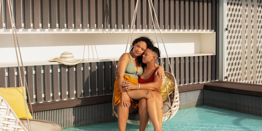 Geo Vanna Gonzalez and Najja Moon enjoy a trip to the Retreat Sundeck pool on Celebrity Edge. (Photo: Naima Green/AIPP)
