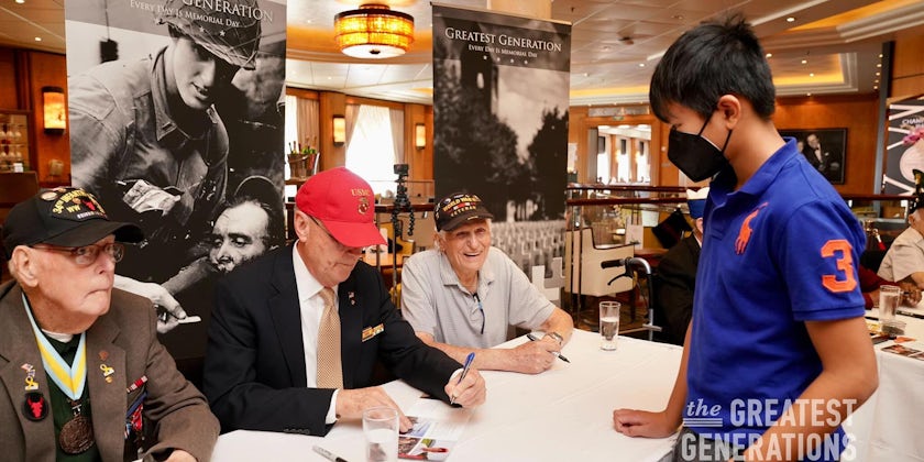 Veterans sign autographs for fans during a Greatest Generations Foundation event. (Photo: John Riedy)