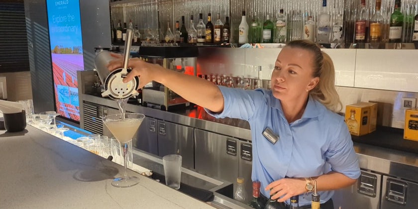 A bartender makes drinks in the Amici Lounge aboard Emerald Azzurra (Photo: Colleen McDaniel)
