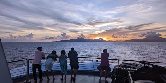 Cruise guests watch the sun set from the sun deck of Star Breeze. (Photo: Colleen McDaniel)