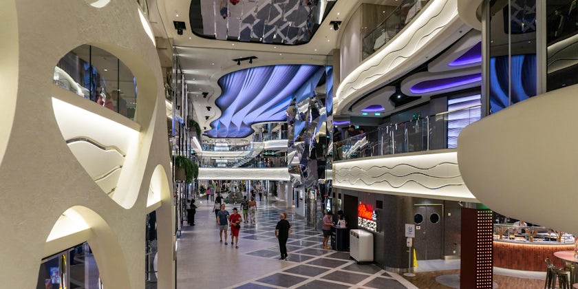 An interior promenade runs from the bow to midship stair towers along Decks 6. 7 and 8 aboard MSC World Europa (Photo: Aaron Saunders)