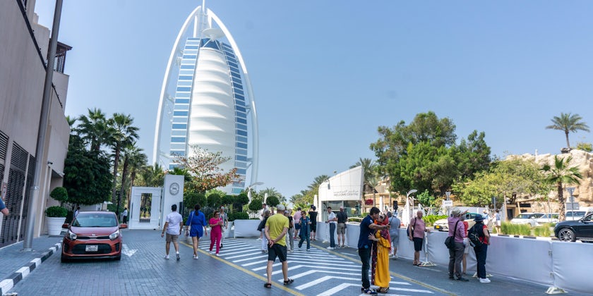 Tourists admire the Jumeriah Burj Al Arab, Dubai's most iconic hotel. (Photo: Aaron Saunders)