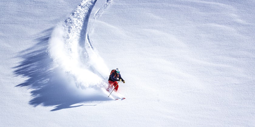 Skier Skiing Down Hill (Photo: MWiklik/Shutterstock)