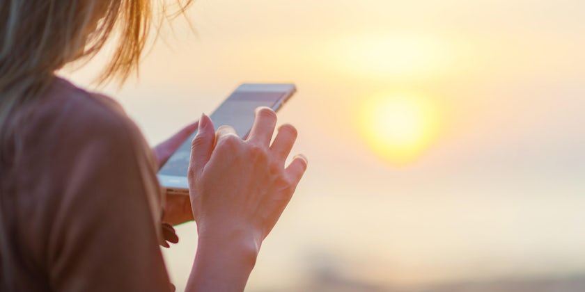 Be mindful of your mobile phone usage while at sea (Photo: tolotola/Shutterstock)