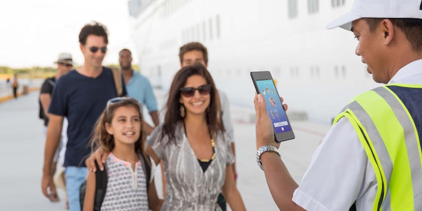 Family of four checking in for their cruise (Photo: Princess Cruises)