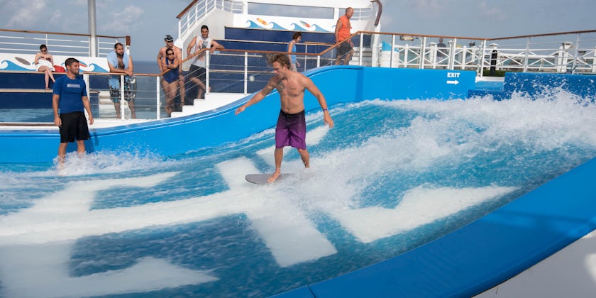 Amateur surfer putting on a show on Freedom of the Seas' Flowrider (Photo: Cruise Critic)