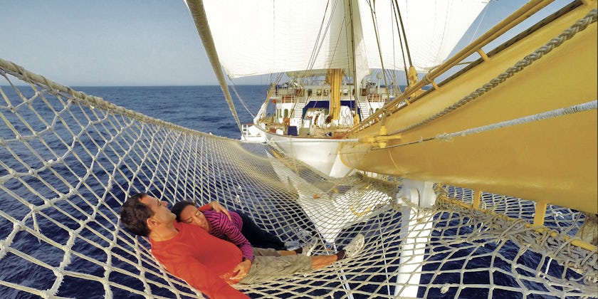Couple lounging on Royal Clipper (Photo: Star Clippers)