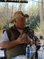 CAJUN PRIDE SWAMP ADVENTURE, BATON ROUGE, LA tour guide holding a baby alligator