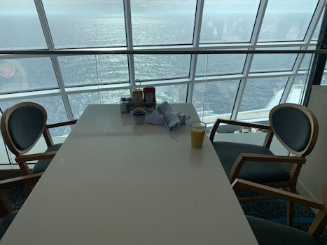 Dining table in the Garden Cafe on Deck 16, overlooking the bow of the NCL Bliss.