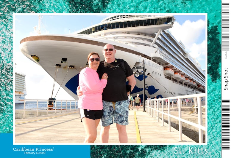 My husband and I in front of the Caribbean Princess at St. Kitts!