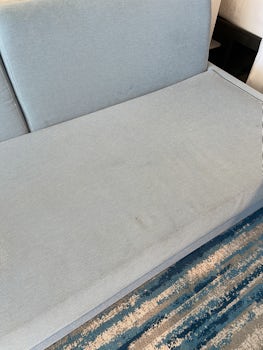 Stained and faded sofa 