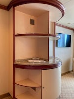 The divider in the centre wall of the mini-suite. There is a fridge and plenty of shelving to use.
