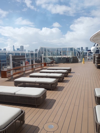 Part of the Yacht Club sundeck.  Much larger than this small portion.  Lounges are luxurious and cushioned.