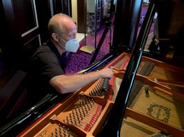 The pianos get tuned before every cruise.