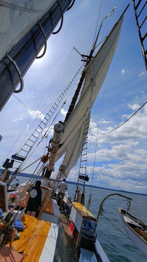 Under full sail, listing to the wind.