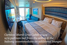 Carnival Mardi Gras Cabin large balcony at no extra cost that can accommodate a lounger; and the cabin has a pullman bed which is great with three people, so that the couch can be used for sitting.