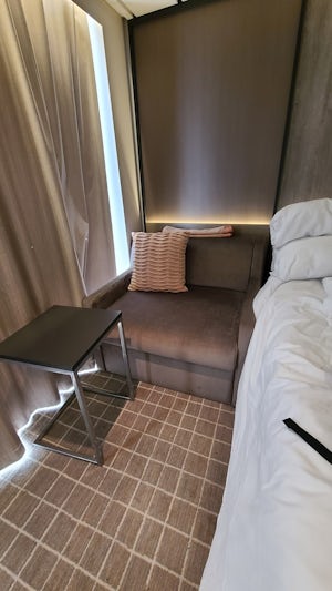 Little loveseat and tray next to our balcony.  We ate our room service breakfast here.  There's metal to use magnet hangers on the wall to the right of the curtains (great lil place for a puffy jacket to stay out of the way)