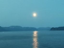 On over way to Barent Sea the moon set the mood over the last islands before meeting the open sea.