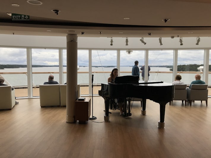 Pianist plays in the Explorers Lounge as we cruise through the beautiful Stockholm archipelago 