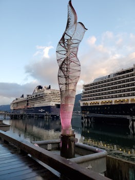 Lighted wire sculpture at sunset in port of Juneau, Alaska.