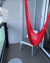 Sea Terrace balcony with 2 chairs, small table and hammock