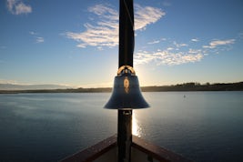 SS Legacy's bell on the bow at sunrise on the Columbia River