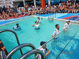 Crew playing volleyball with passengers