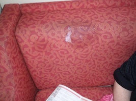 Multiple stains on sofa first day in cabin