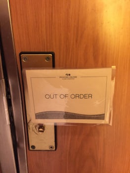 One of the many out of order signs on all of the toilets.