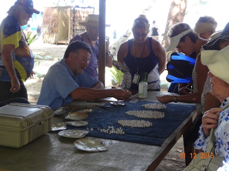 Anyone for fresh pearls. Local producer shows how it's done on Doini Is