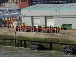 Irish Guard waving good-bye from dock in Southampton