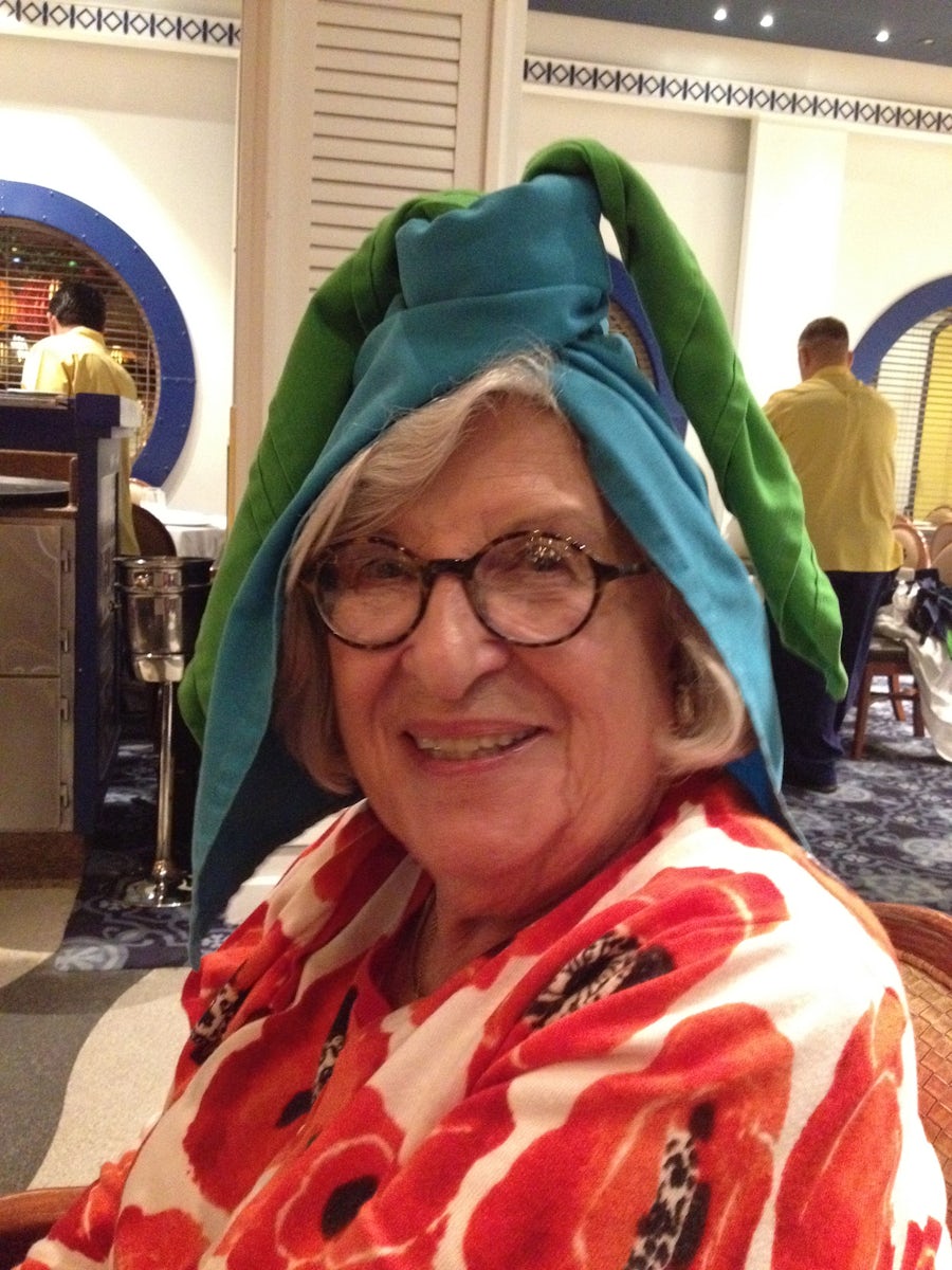Great Grandma at dinner after the wait staff gave everyone handmade hats.