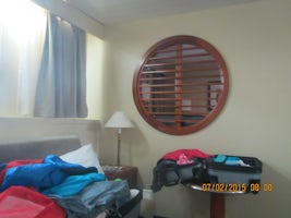 Bedroom on other side of louvers.  Porthole near water level.