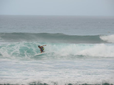 Winter waves and surfers on Oahu's North Shore.
