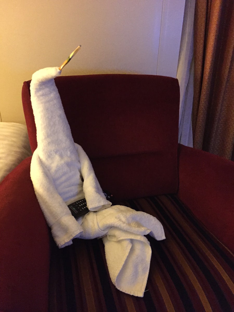 Fun cabin towel creature, sitting with remote
