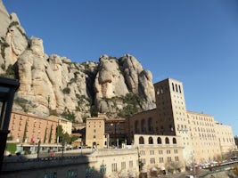 Montserrat Abbey built on the side of a mountain.