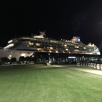 Photo of cruise ship at night when docked in Cairns port.